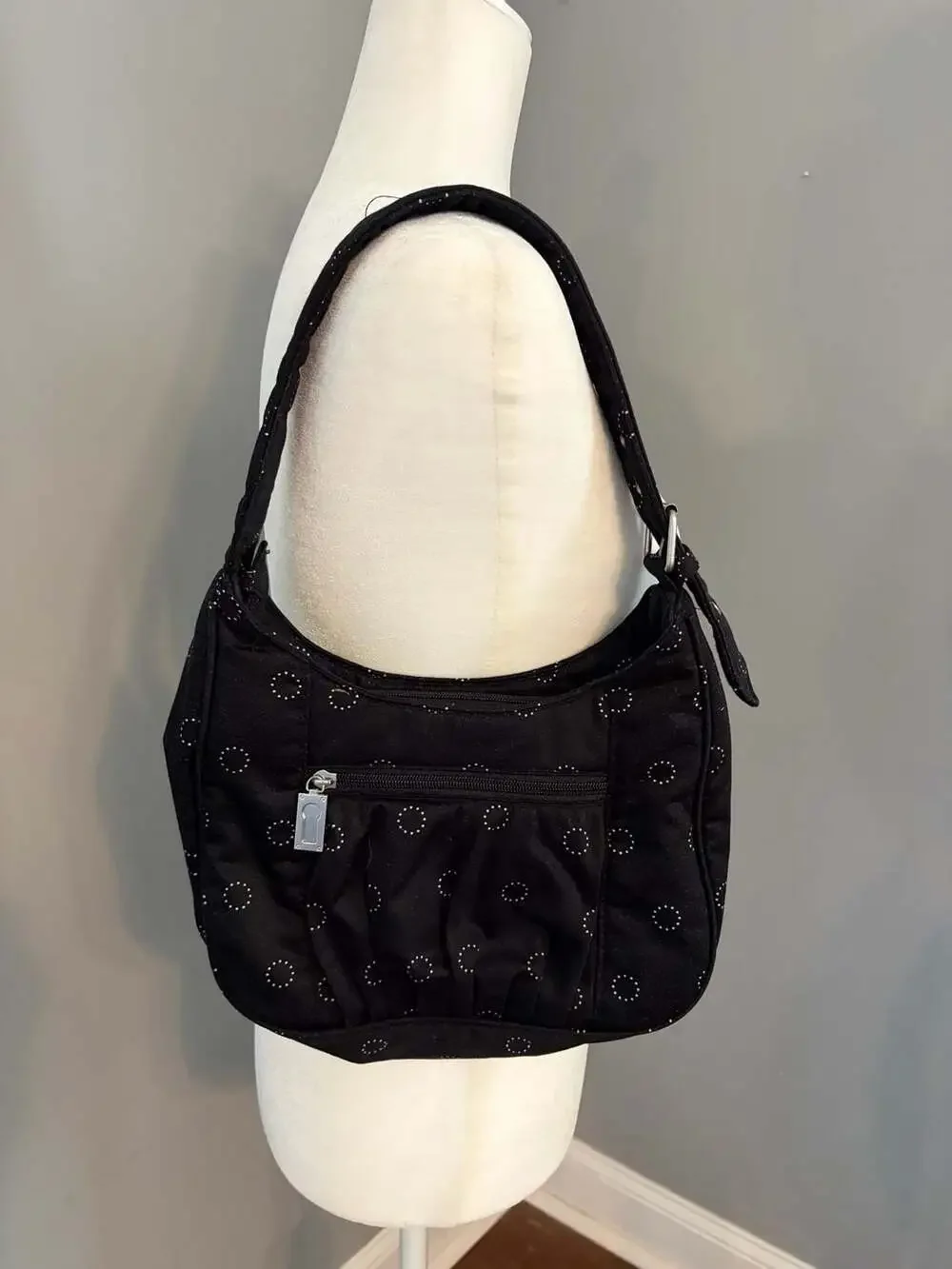 Thirty-One black hobo shoulder bag with white polka dot circles and striped inte